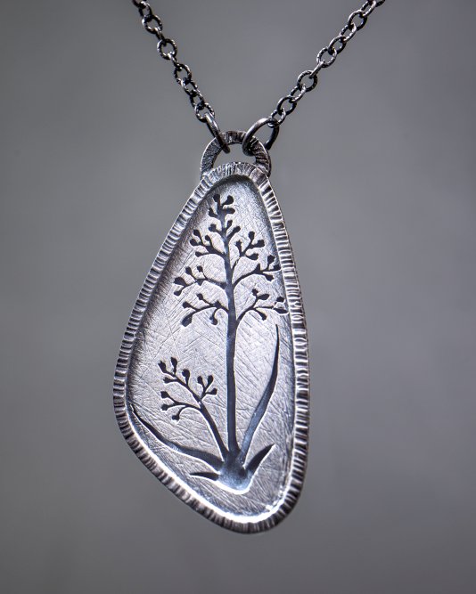 Plant silhouette silver pendant
